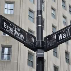 street signs for Broadway and Wall Street