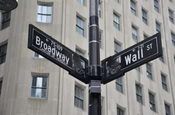 street signs for Broadway and Wall Street