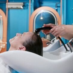 woman having her hair shampooed