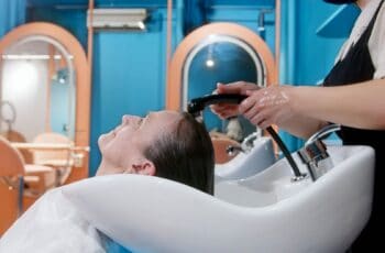 woman having her hair shampooed