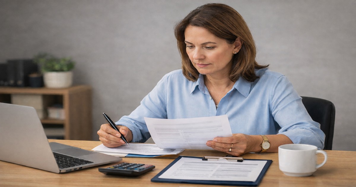 business owner reviewing documents while preparing a small business loan application