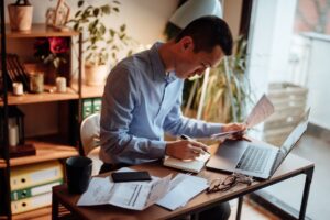 small business owner reviewing financial documents showing fast financing dependence