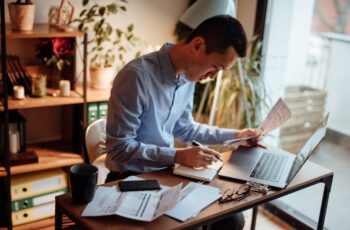 small business owner reviewing financial documents showing fast financing dependence